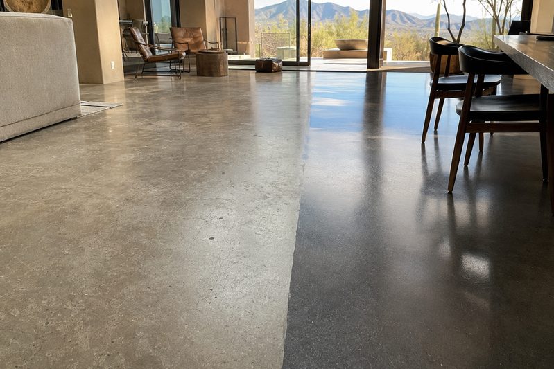 Polished concrete floor in an open-plan interior, matte section beside a polished section