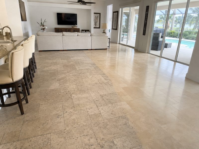 Travertine floor in an open-plan living room, dull surface on the left and polished on the right